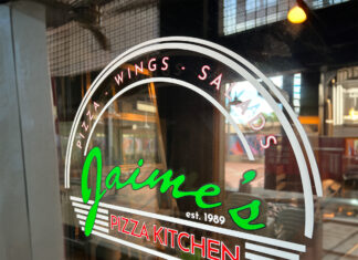 Front window of Jaime's Pizza Kitchen with the restaurant logo visible